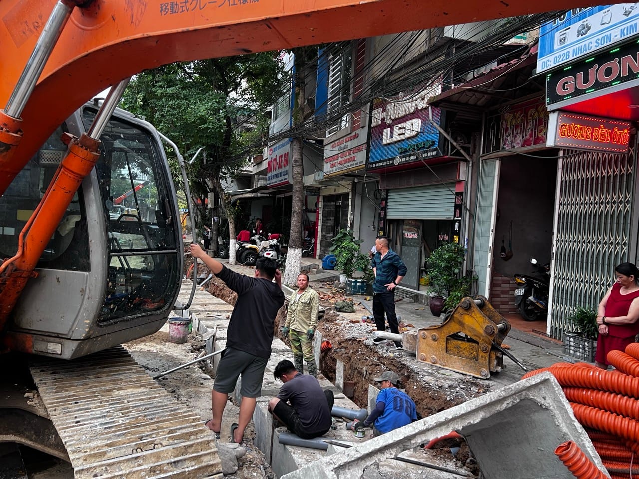 excavator and construction work on a street in Lao Cai Vietnam