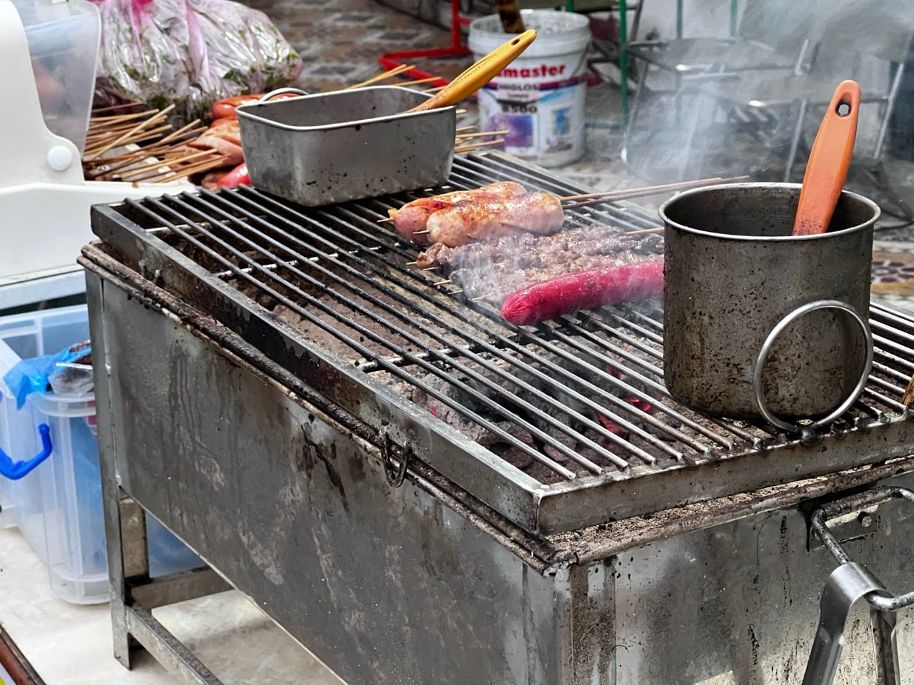 street barbecue grill with skewers at evening in Lao Cai Vietnam