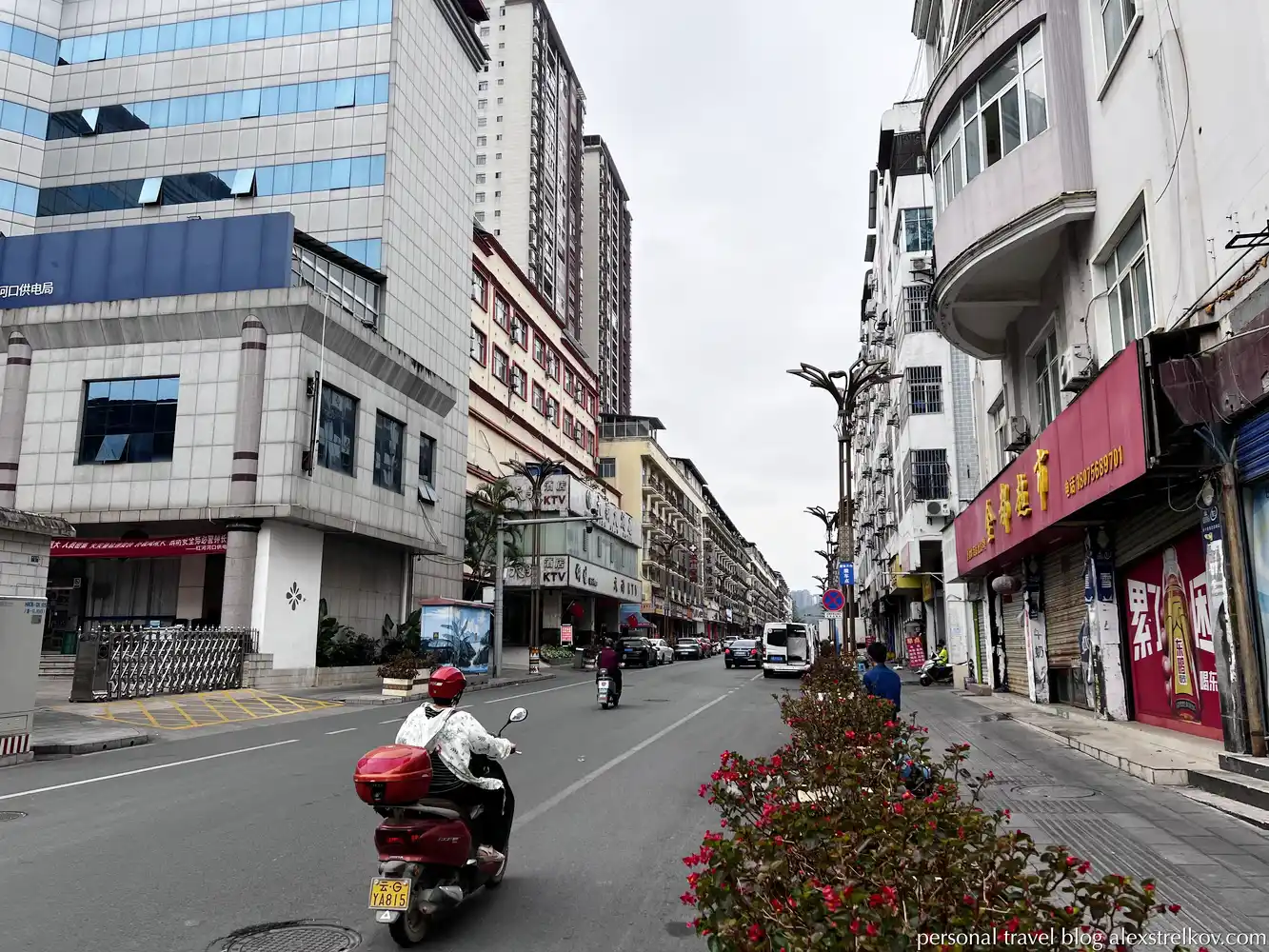 street in Hekou residential buildings electric scooters