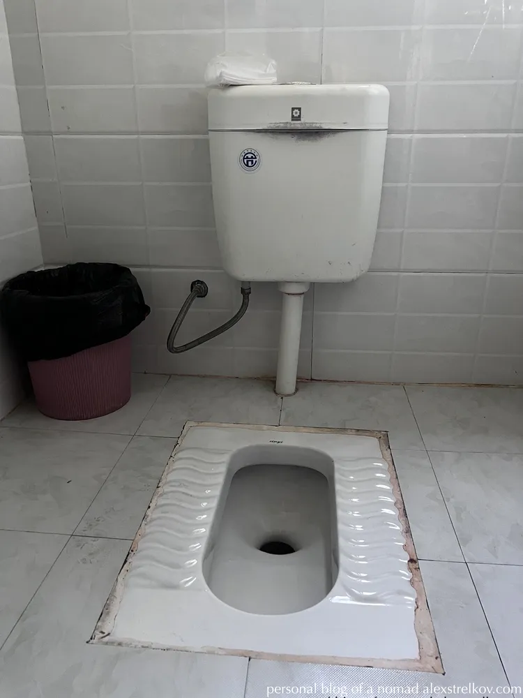 squat toilet in Chinese hotel Furong Town, traditional bathroom