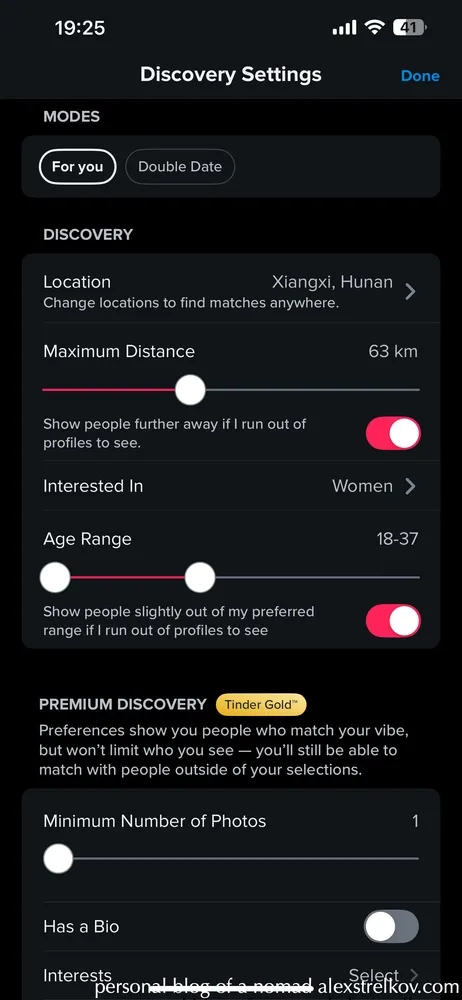 Tinder Discovery Settings screen in China showing location as Xiangxi Hunan