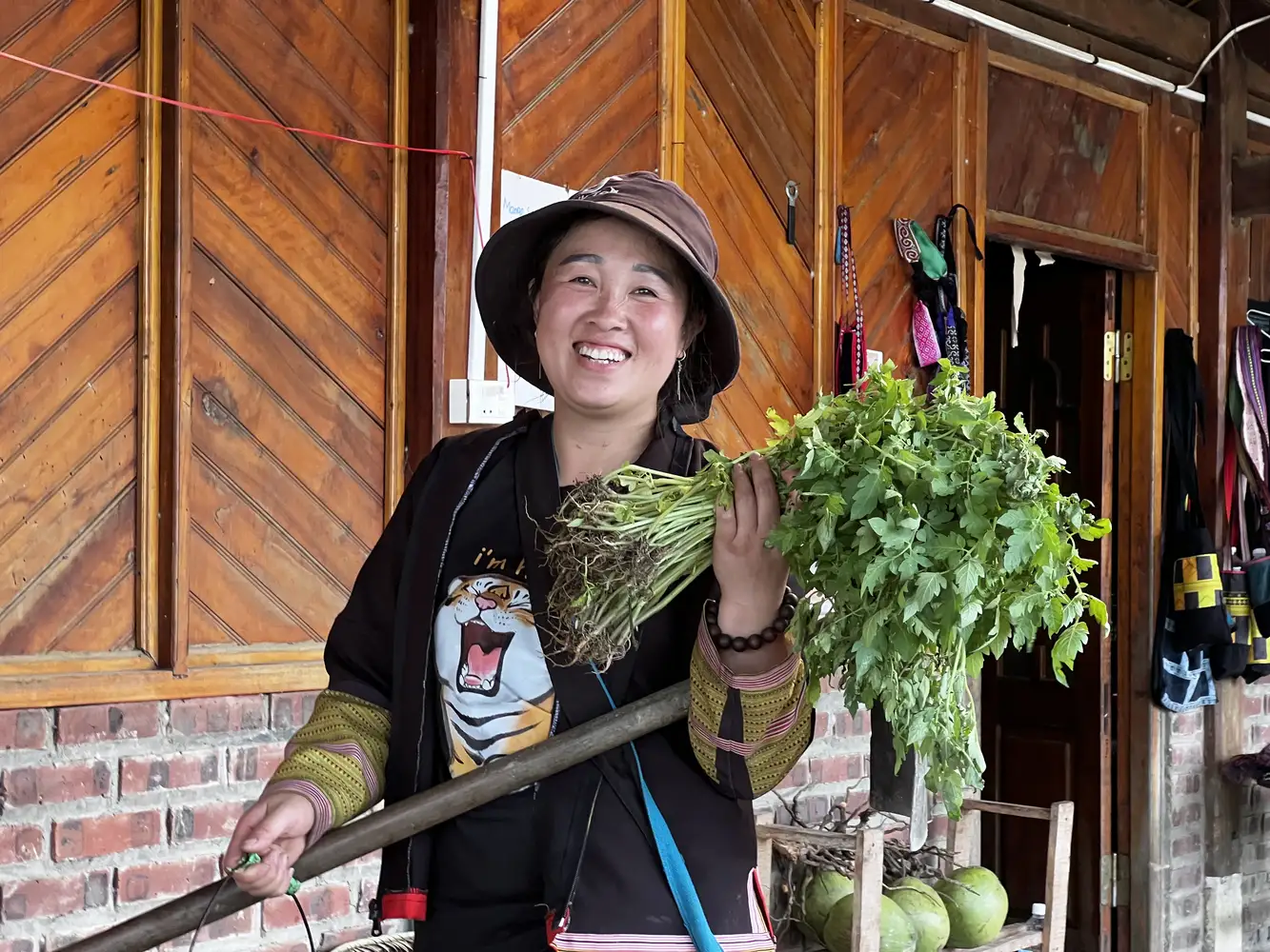 A member of the Pham family helping with the daily farm and household tasks in Sapa.