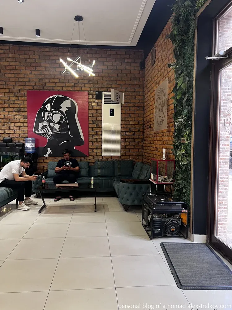 Baza Barbershop waiting area green sofa Darth Vader Samarkand