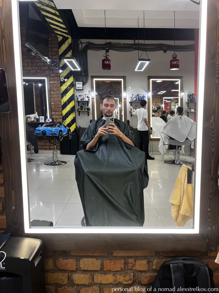 traveler in barber chair Baza Barbershop Samarkand mirror selfie